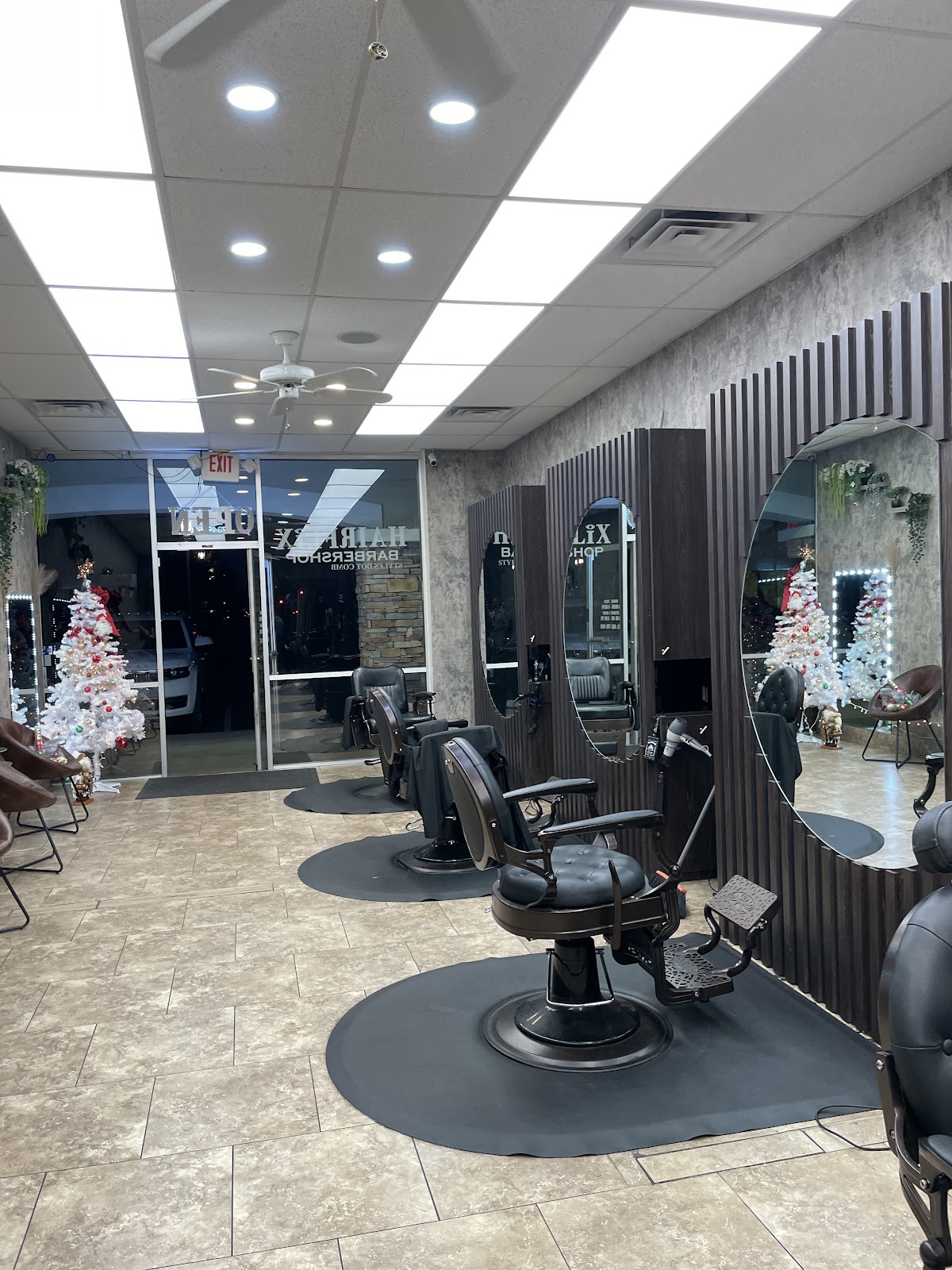 Inside the Scottsdale shop: round mirrors, wood slat walls and vintage barber chairs