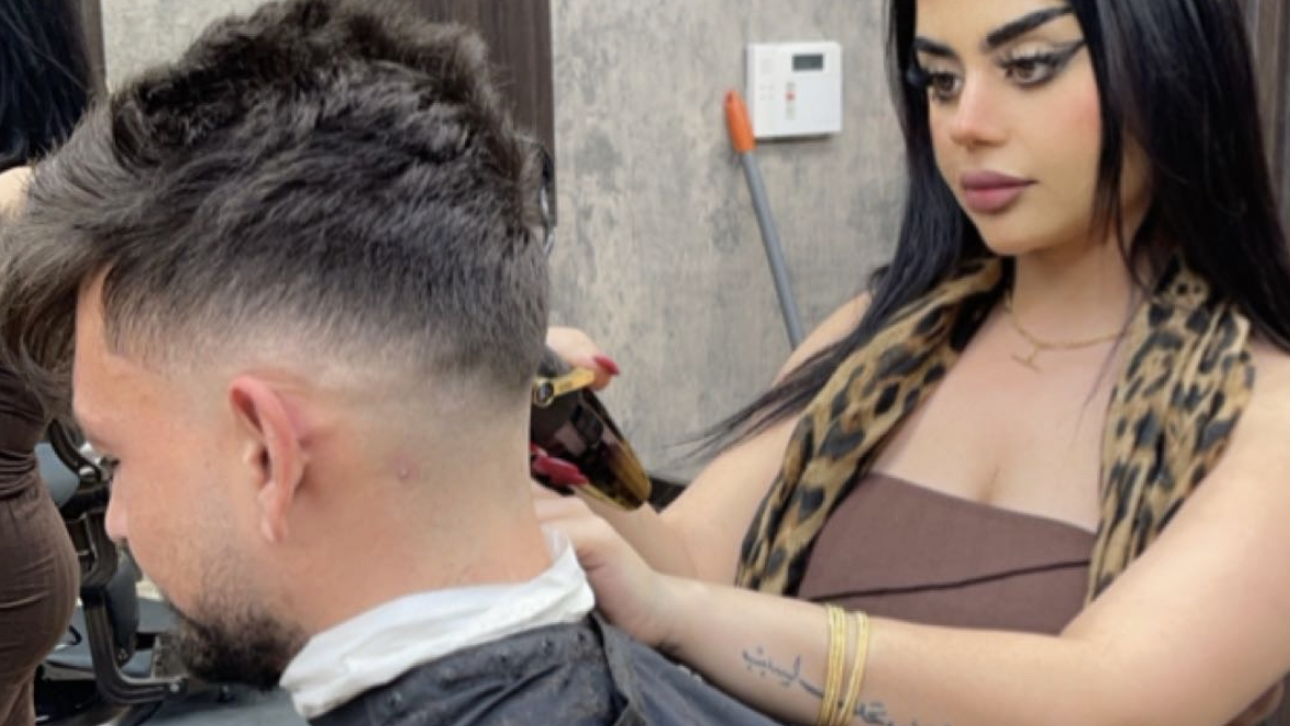 One of our barbers guiding gold clippers through a fade at the Scottsdale shop